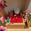 The lottery number board game includes a ball-shaking device and panels numbered 1 to 90 for casual interactive family gatherings and fun toys for multiple people details Picture